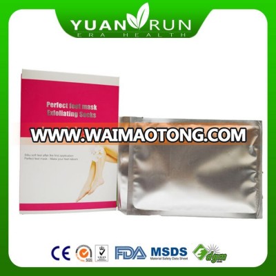 Female Using Foot peeling and whitening spa socks exfoliating foot mask